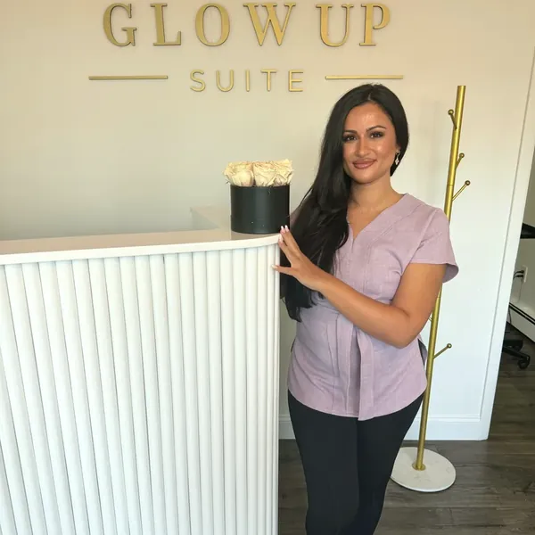 Marilena at the Glow Up Suite front desk at Glow Up Suite, on Instagram